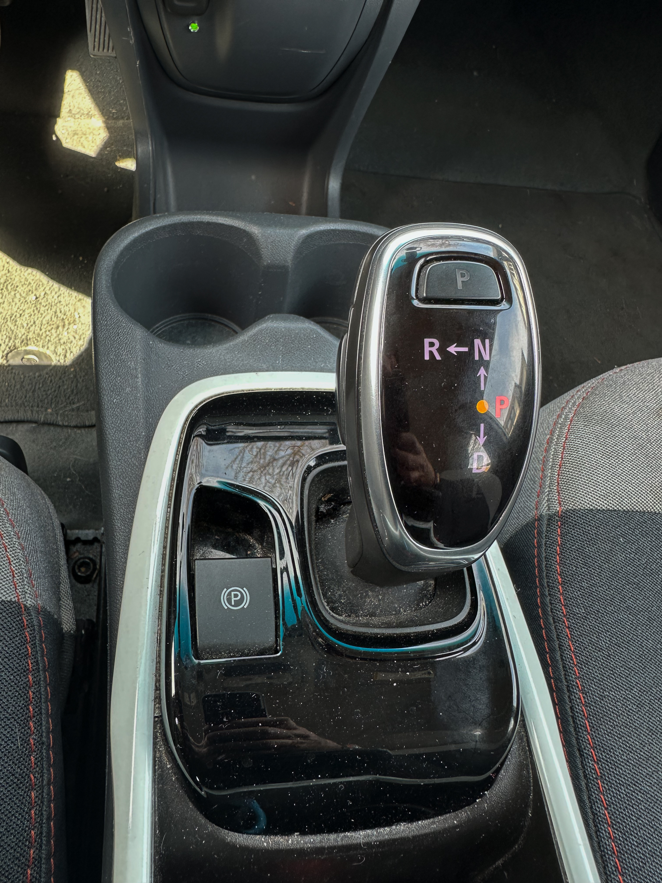 A photo of the center console of the Chevy Bolt, showing the parking brake