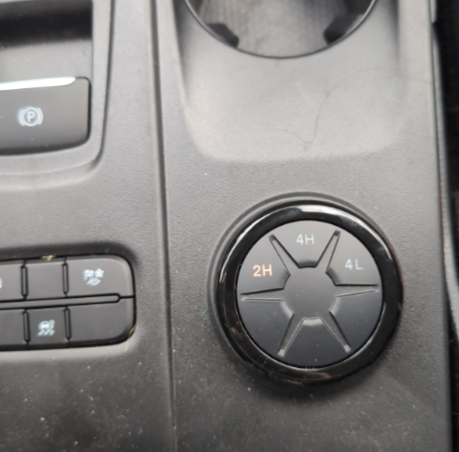 photo of Ranger 4WD wheel, a circle with 2H, 4H, and 4L buttons